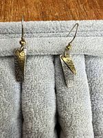 Full view of both earrings on display pad