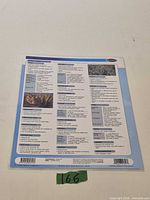 Back panel of laminated reference chart showing text columns and photos