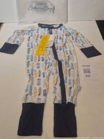 Full view front of romper with tags attached