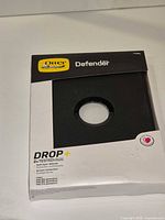 Front of OtterBox Defender Series box displaying model compatibility and drop test information