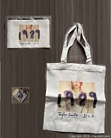 Tote bag, sealed pouch and keychain displayed