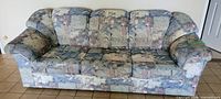 full front view of patterned 3-seater couch