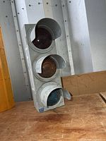 Front view of metal traffic signal showing all three lenses