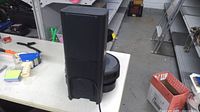 Clean Base tower shown rear/side with robot vacuum partially visible