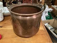 Front view of copper bucket on table