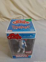 Front view of boxed Mystique figure
