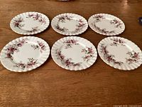 Six Royal Albert Lavender Rose bread plates displayed front side
