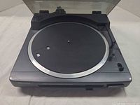 Top view showing platter, tonearm, and dust cover