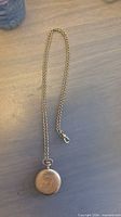 Pocket watch with attached chain full view