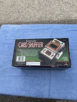 boxed automatic card shuffler on table