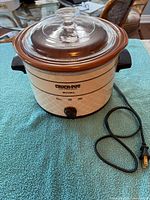 Front view of Rival Crock-Pot showing housing, lid, power cord and control knob