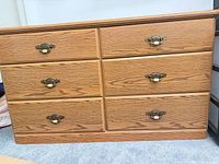 Front view showing six drawers and hardware