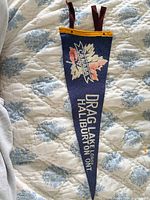 Full view of pennant showing graphics, header, and ties