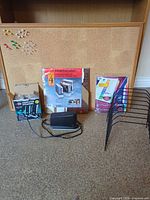 Overall view of bulletin board, speakers, magazine files, dividers, file holder