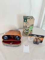 Full lot showing binoculars in case, boxed lantern, sealed Duracell D batteries