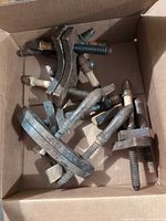 overview of all clamps in cardboard box
