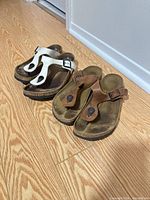 Both pairs of Birkenstock Gizeh sandals side by side