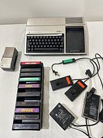 Overall view showing computer, speech module, cartridge rack, joysticks, power supplies and cables