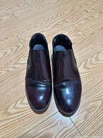 Top view of both shoes showing color, style and wear