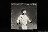 Front of album jacket featuring Laurie Anderson in white suit