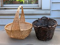 Both wicker baskets side by side showing size, color and handle styles