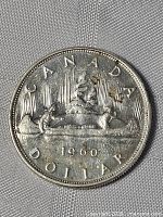 Reverse of 1960 Canadian silver dollar showing Voyageur design