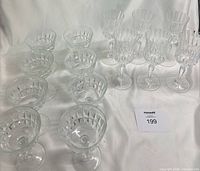 Full set of 14 stemware pieces showing both coupes and wine goblets
