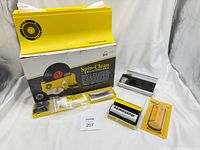 Full kit laid out: basin atop box, accessories in front