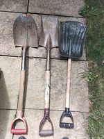 Three shovels side by side showing heads and handles