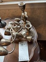 Pair of weighted silver candlesticks with threaded tops and tangled candelabra arms
