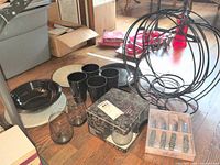 Overview of all items: tumblers, smoky glasses, plates, Krosno box, knife set, wire bottle rack