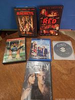 All six movie discs and cases displayed on table