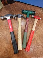 Front view of four hammers showing types and handles