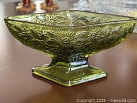 Side profile of avocado green pressed glass diamond pedestal bowl
