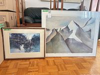 Both framed artworks side by side showing relative sizes and frames