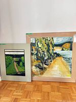 Two framed paintings side by side