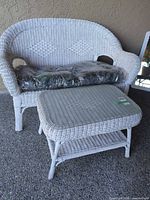 Loveseat, ottoman and cushions full view