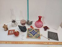 Entire lot arranged for overview showing all twelve items with rulers for scale.