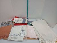 Bundle of assorted napkins and placemats spread out
