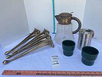 All items overview: four brass legs, glass carafe, Stanley cook pot, two green cups