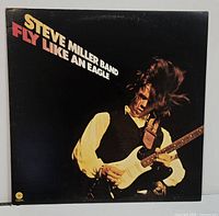 Front cover of Steve Miller Band Fly Like an Eagle LP showing artwork and condition