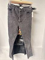 Front view of Dynamite washed black jeans hanging