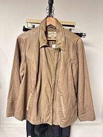 Front view of tan Lucky Brand jacket showing zip front, pockets, overall condition