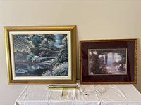 Both framed prints and picture light displayed together