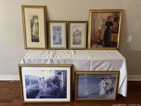 Group shot of all six framed prints on table