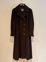 Front view of chocolate brown MaxMara coat on hanger