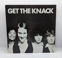 Front album cover with title and band photo