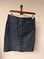 Front view of denim skirt on hanger