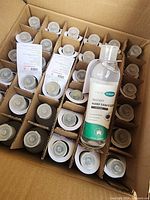 Open carton showing 36 sealed bottles in partitions with flip caps and labels visible