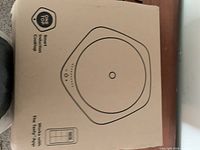 Sealed box showing outline of Tasty One Top smart induction cooktop